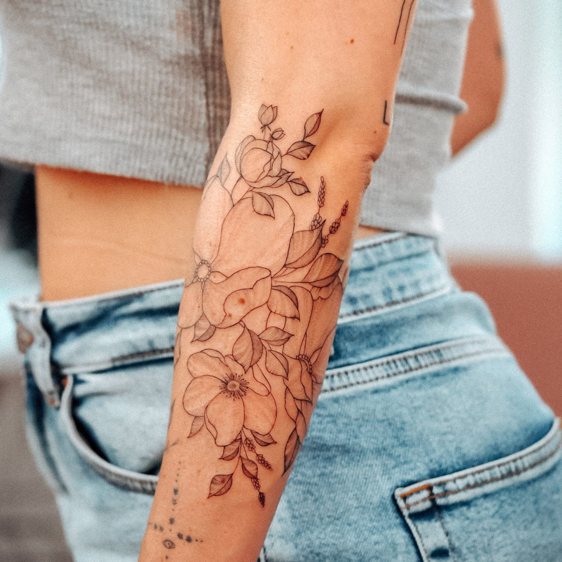 Wild flower sleeve fineline tattoo