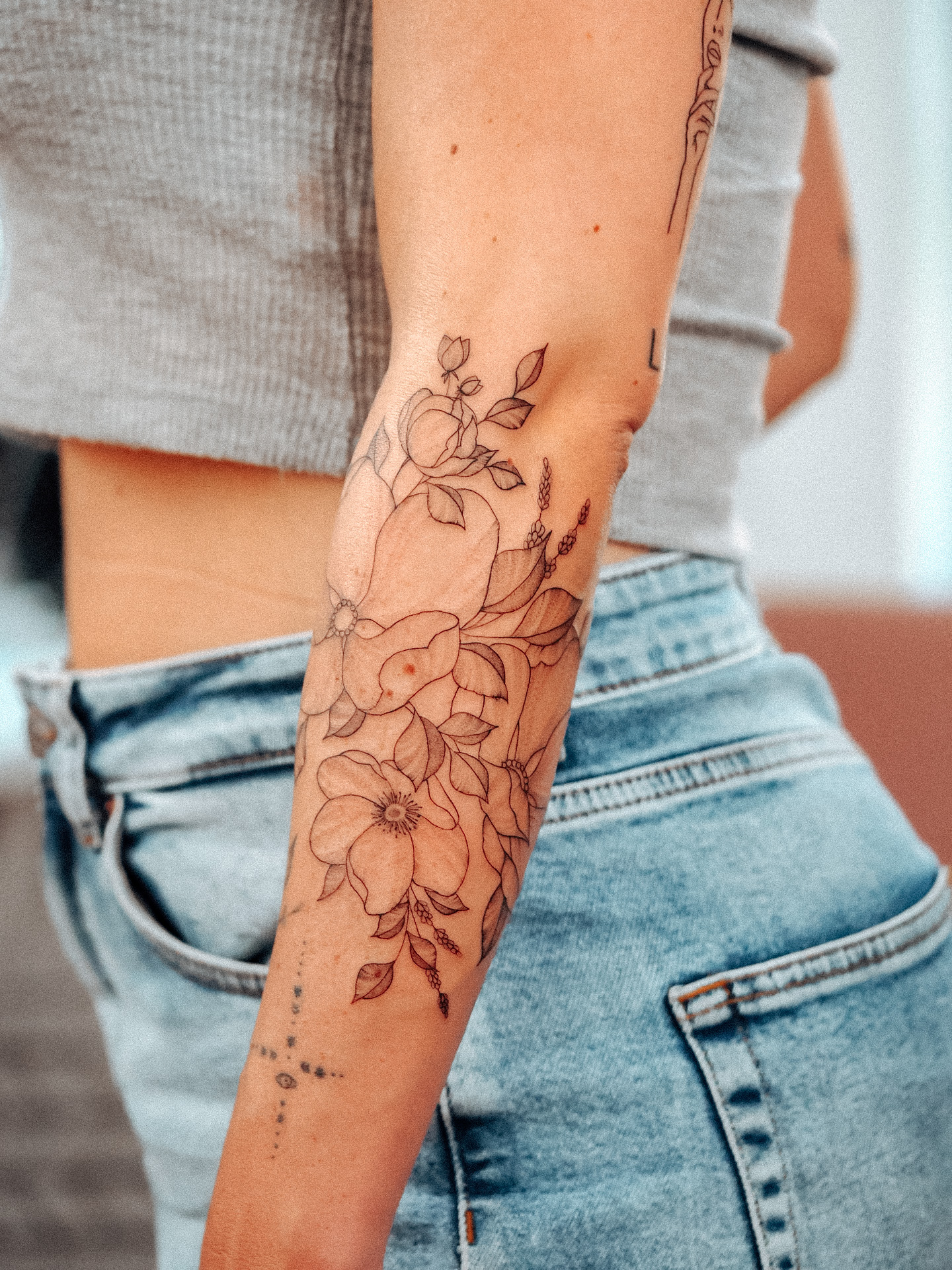 Wild flower sleeve fineline tattoo