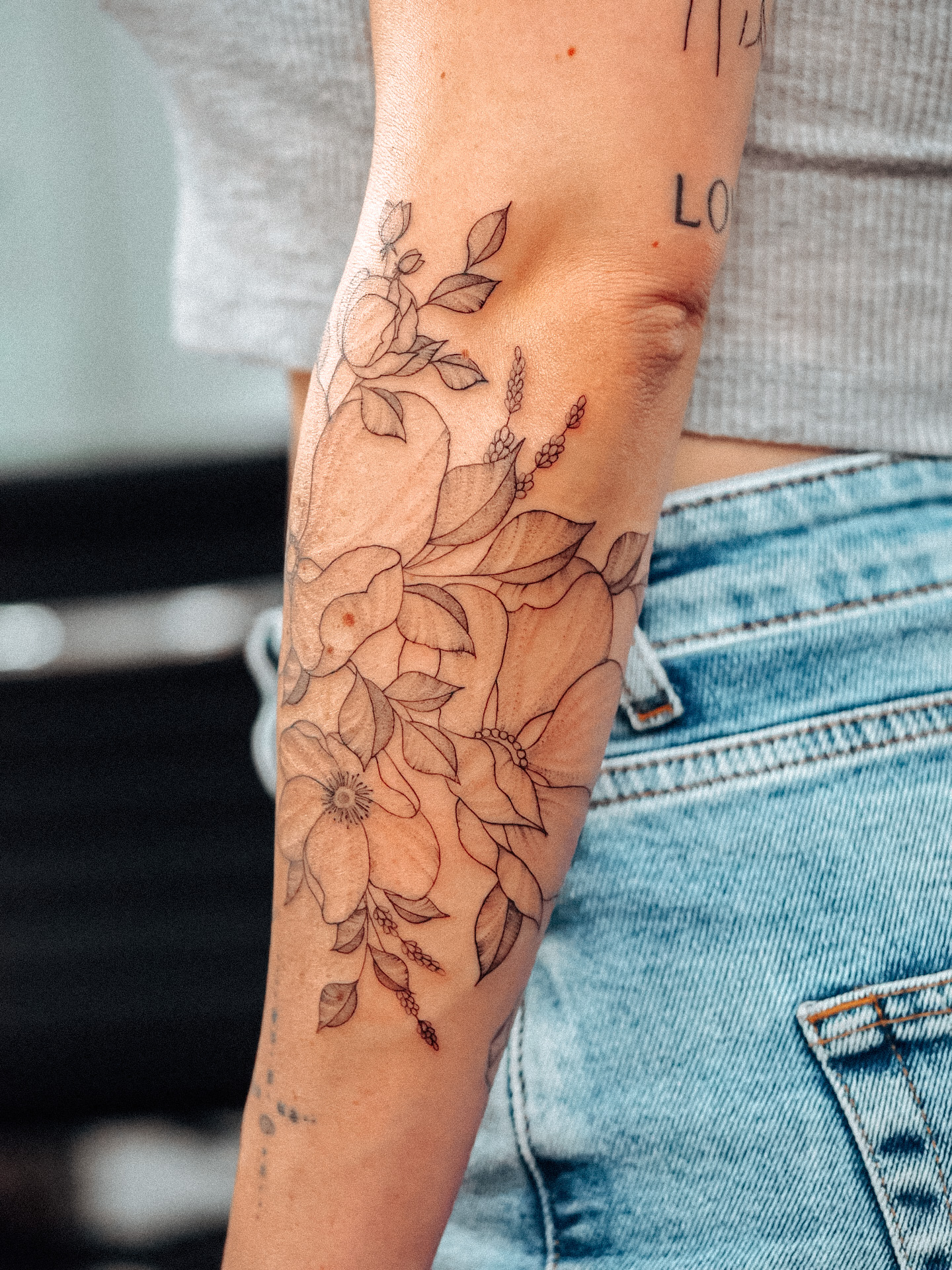 Wild flower sleeve fineline tattoo