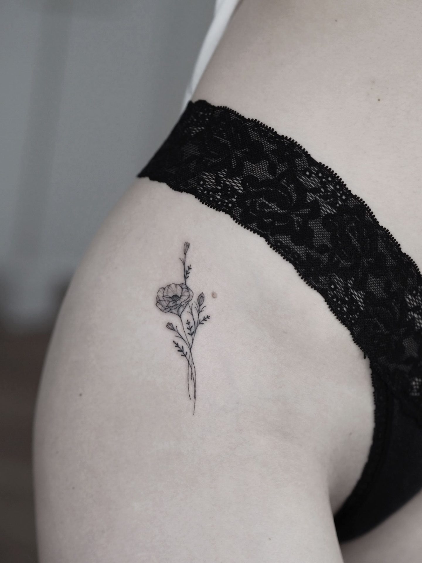 Fineline Poppy wildflower tiny bouquet tattoo by Alina BUNAMI INK