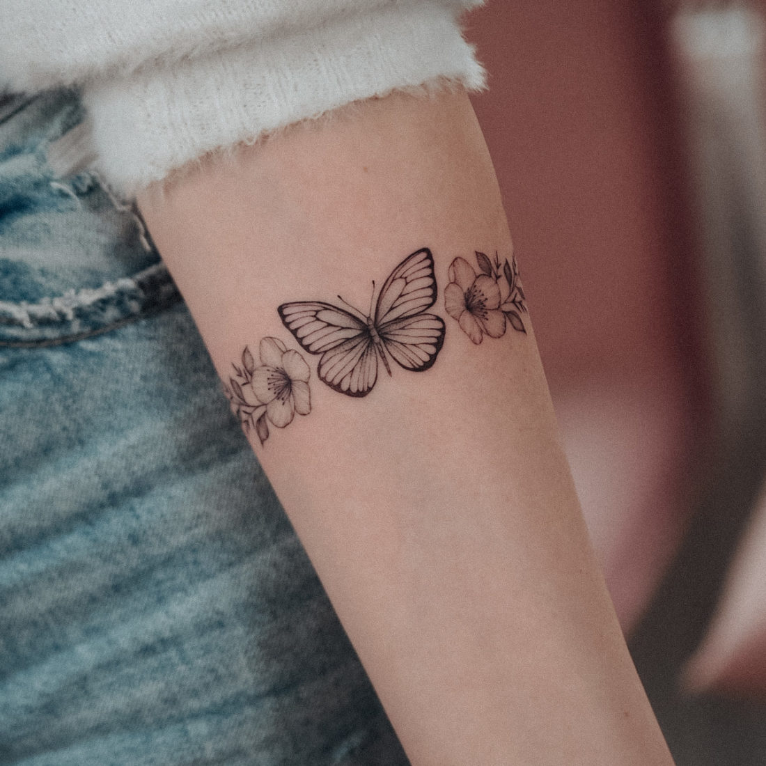 Butterfly & cherry blossom bracelet tattoo by Alina BUNAMI INK