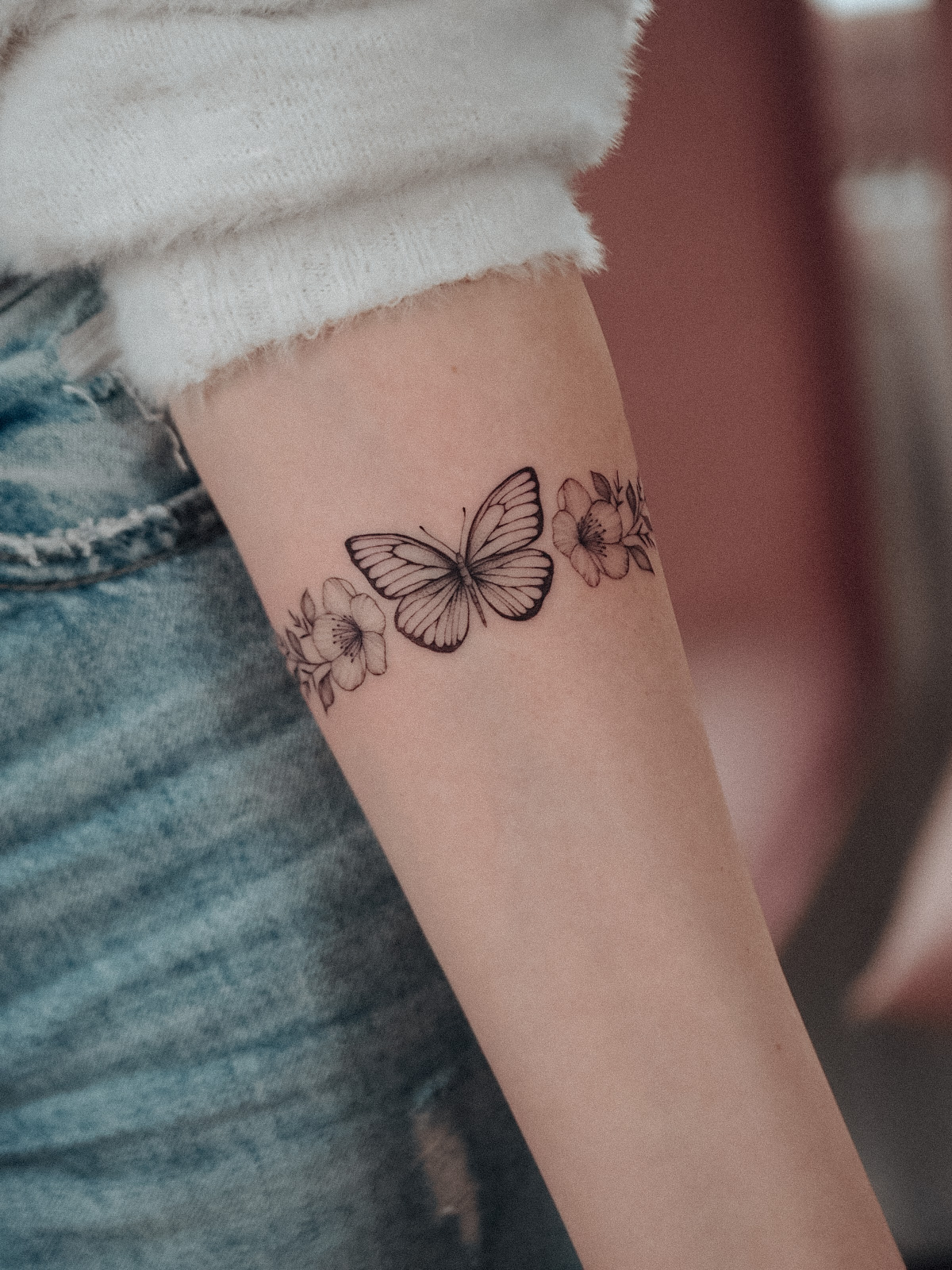Butterfly & cherry blossom bracelet tattoo by Alina BUNAMI INK